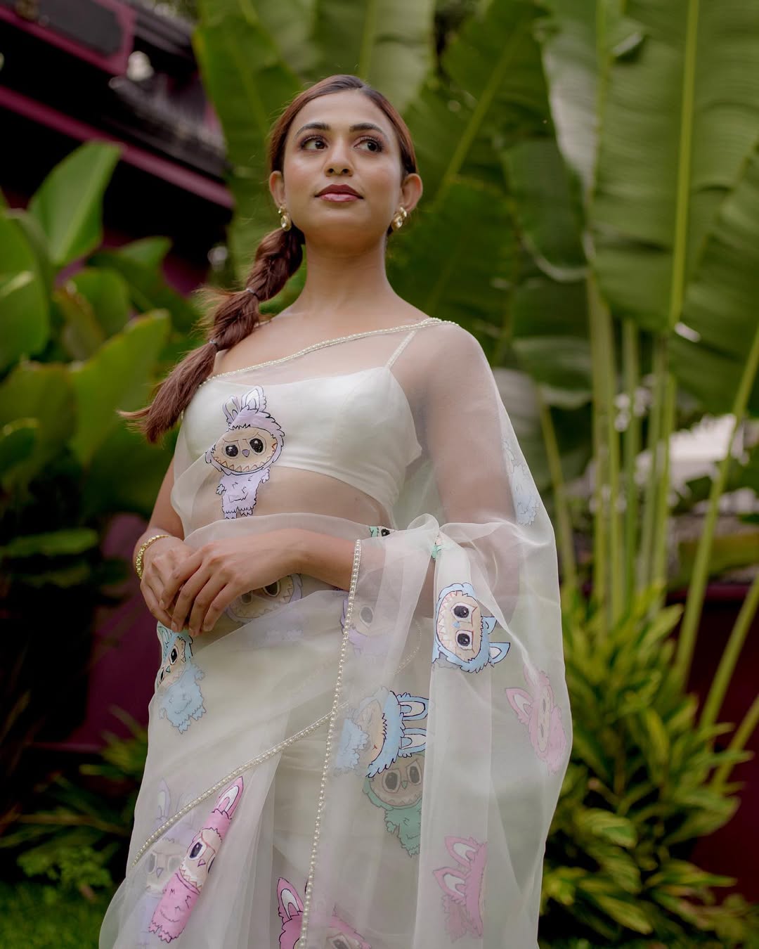 Dreamy Organza Cartoon Motif Saree. Crafted from lightweight and sheer premium organza fabric, this saree blends modern quirkiness with timeless charm.