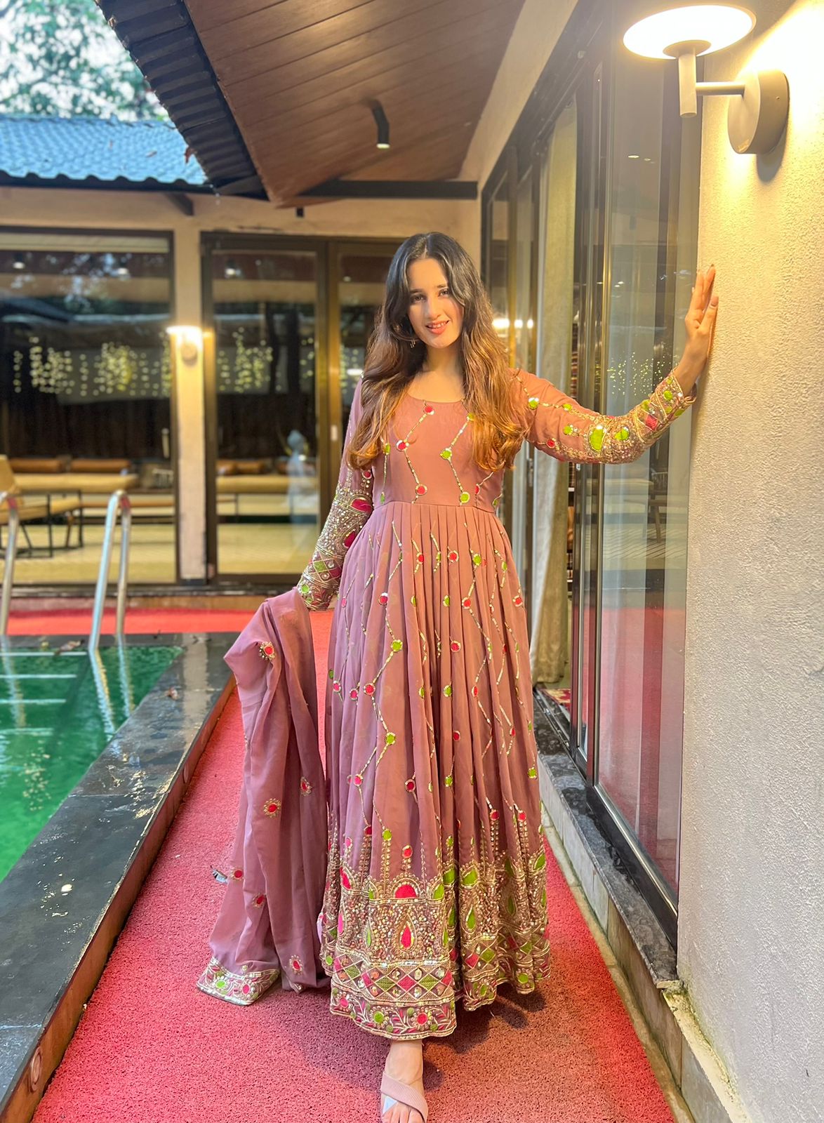 Imposing Sequence And Embroidery Work Peach Color Gown