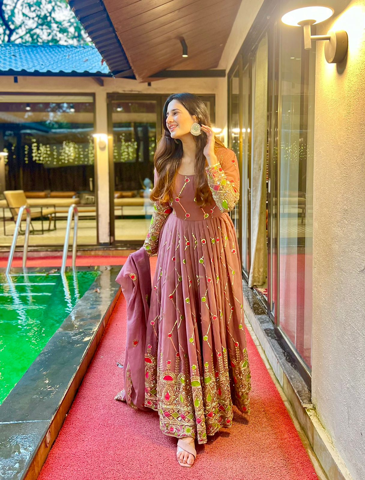 Imposing Sequence And Embroidery Work Peach Color Gown