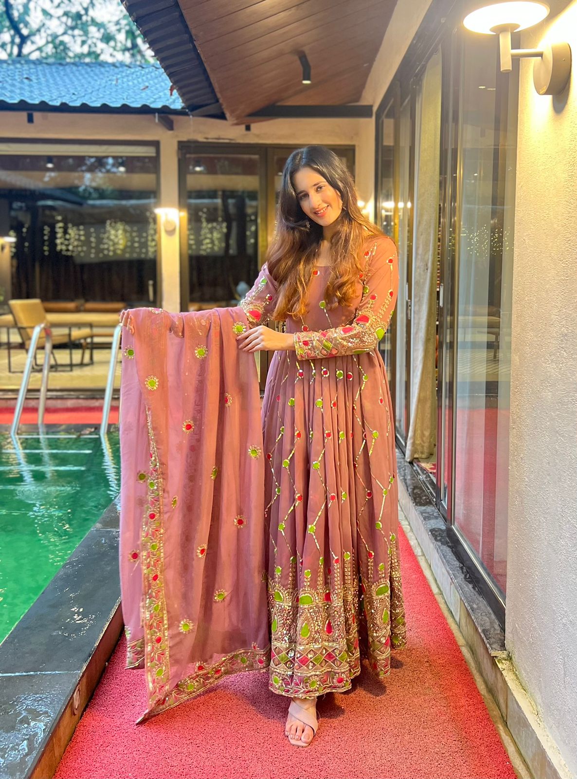 Imposing Sequence And Embroidery Work Peach Color Gown