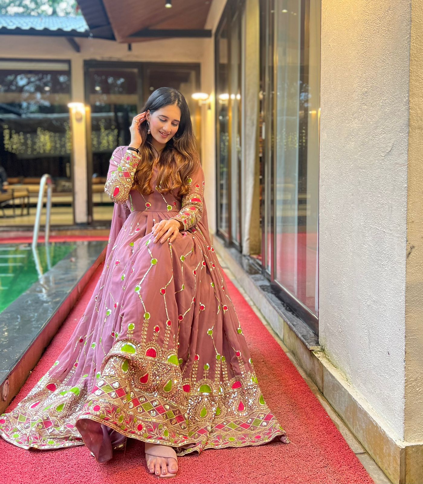 Imposing Sequence And Embroidery Work Peach Color Gown